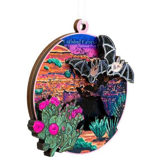 Decorative ornament with bats and cacti design, featuring Carlsbad Caverns National Park text.