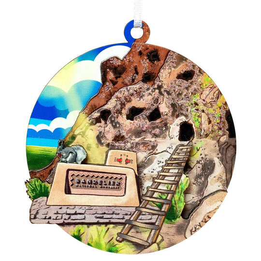 Decorative ornament with a cave entrance, ladder, and sign on a white background