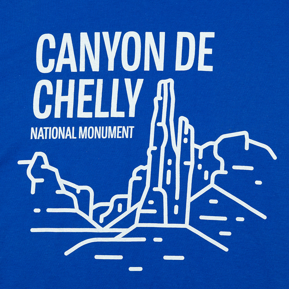 Blue t-shirt with white text and graphic of Canyon de Chelly National Monument