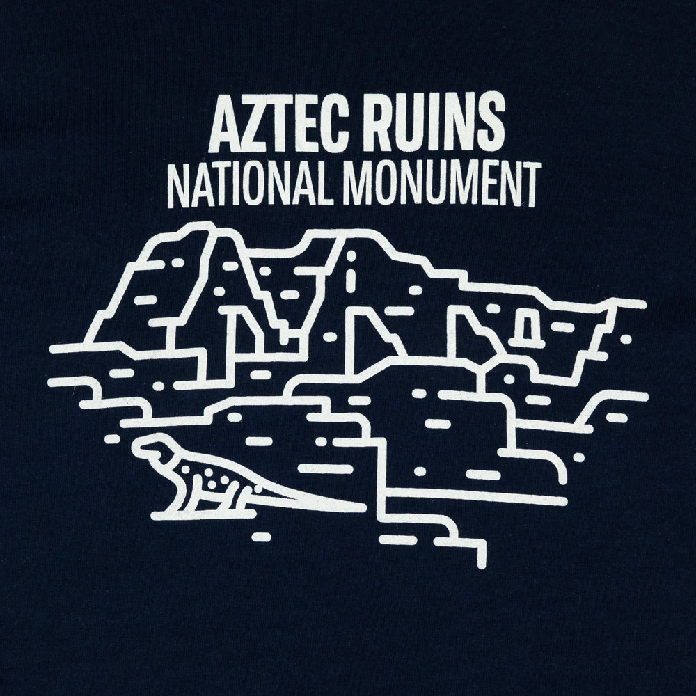 Aztec Ruins National Monument Fell logo design detail on a dark blue T-shirt