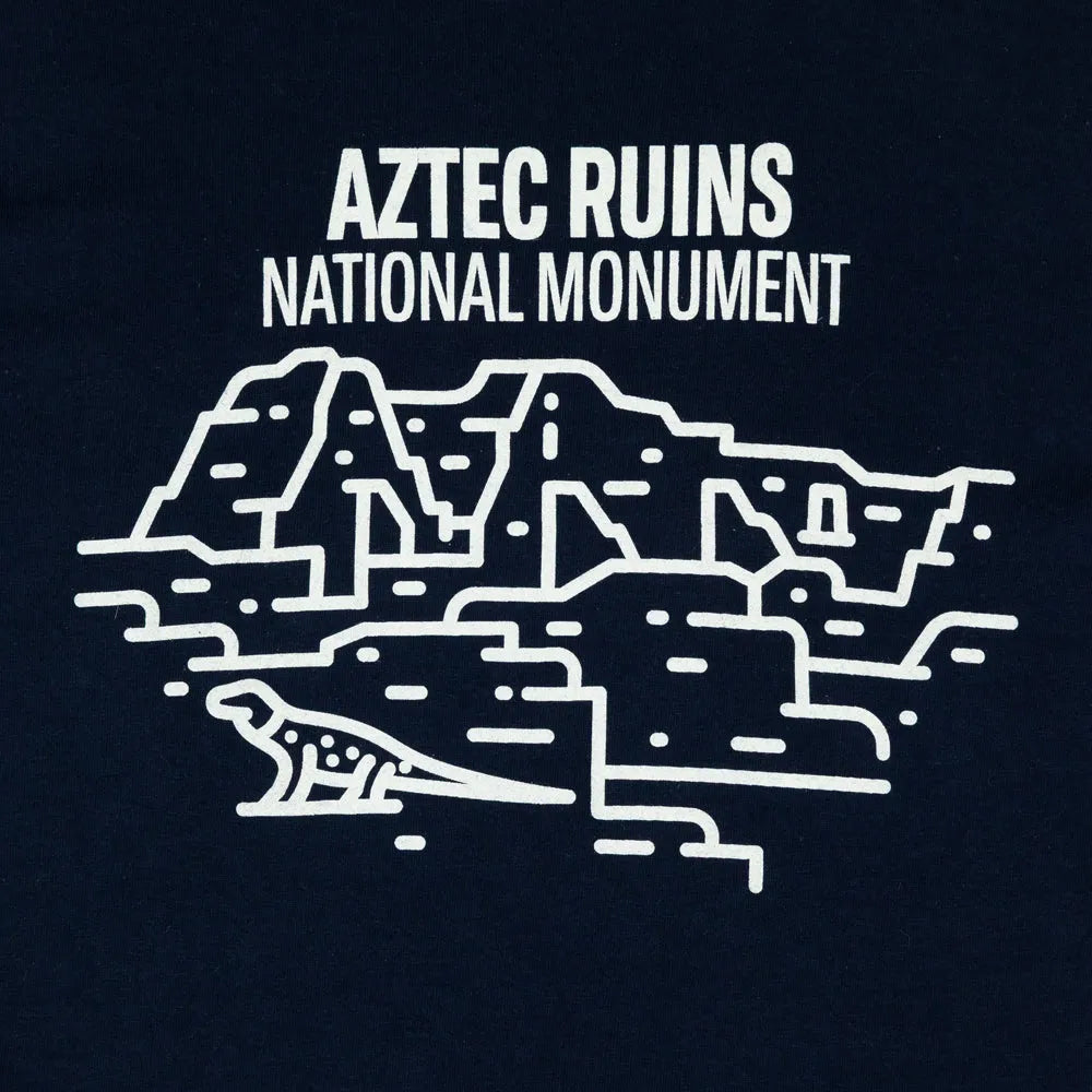 Aztec Ruins National Monument Fell logo design detail on a dark blue T-shirt