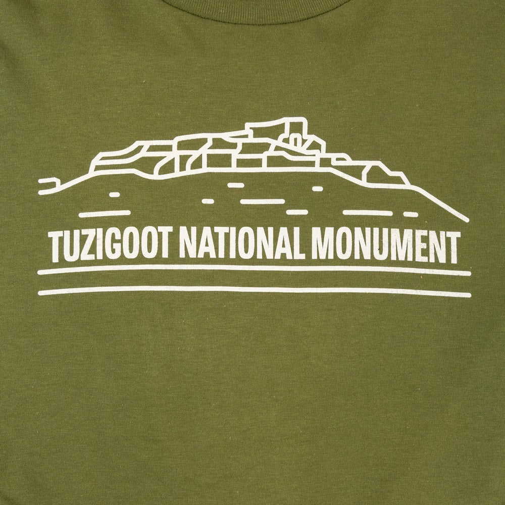 Green t-shirt with white outline of Tuzigoot National Monument and text on a green background