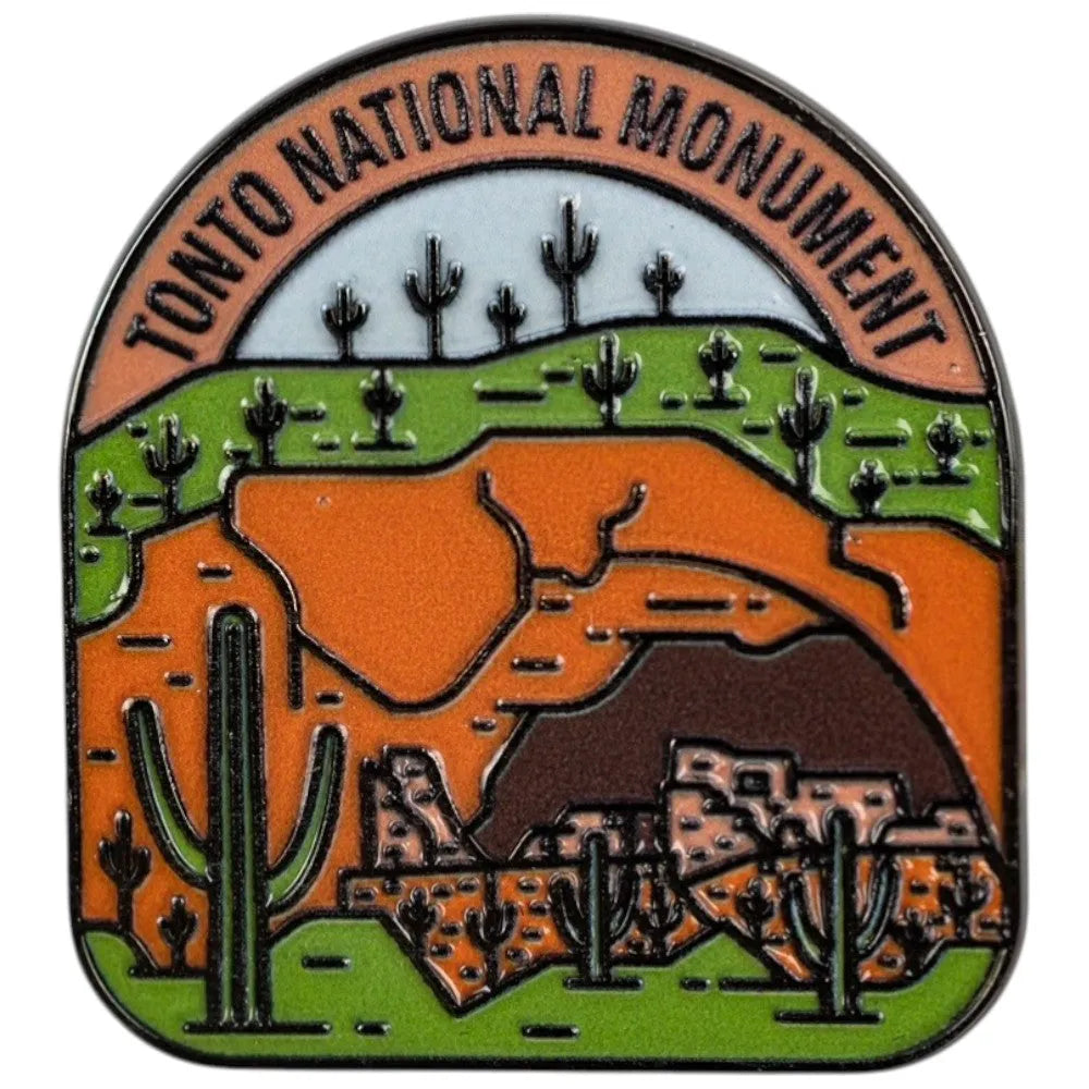 Pin with Tonto National Monument design featuring desert landscape and cacti.