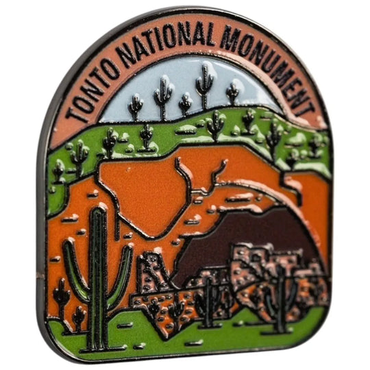 Pin with Tonto National Monument design featuring desert landscape and cacti.