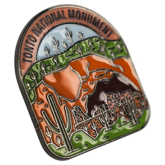 Pin with Tonto National Monument design featuring desert landscape elements.