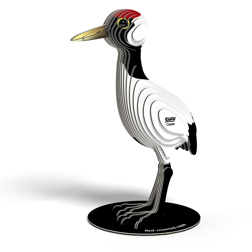 Decorative sculpture of a red-crowned crane on a white background
