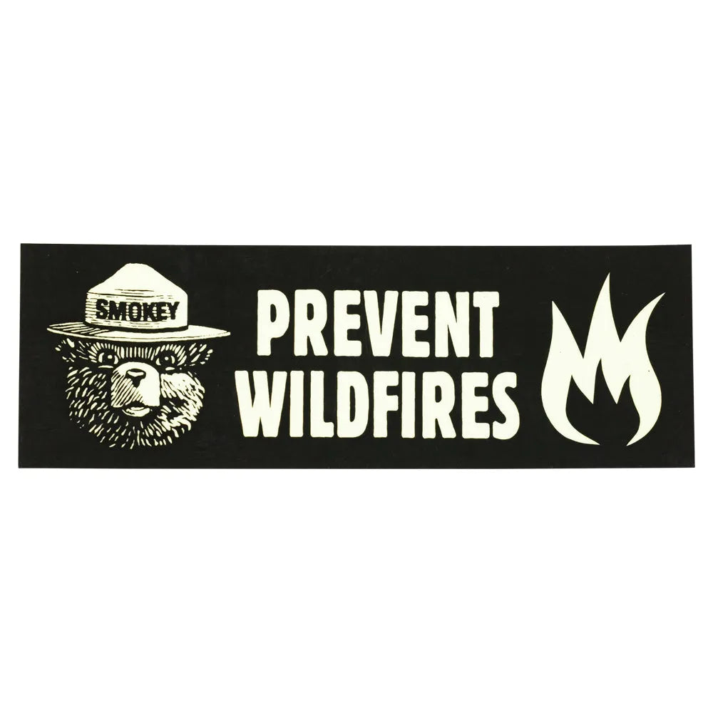 Sticker with Smokey Bear logo and 'Prevent Wildfires' text on a black background