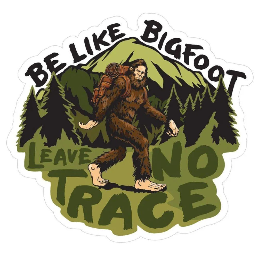 Sticker with a cartoon Sasquatch and mountainous background with text 'Be Like Bigfoot, Leave No Trace'.