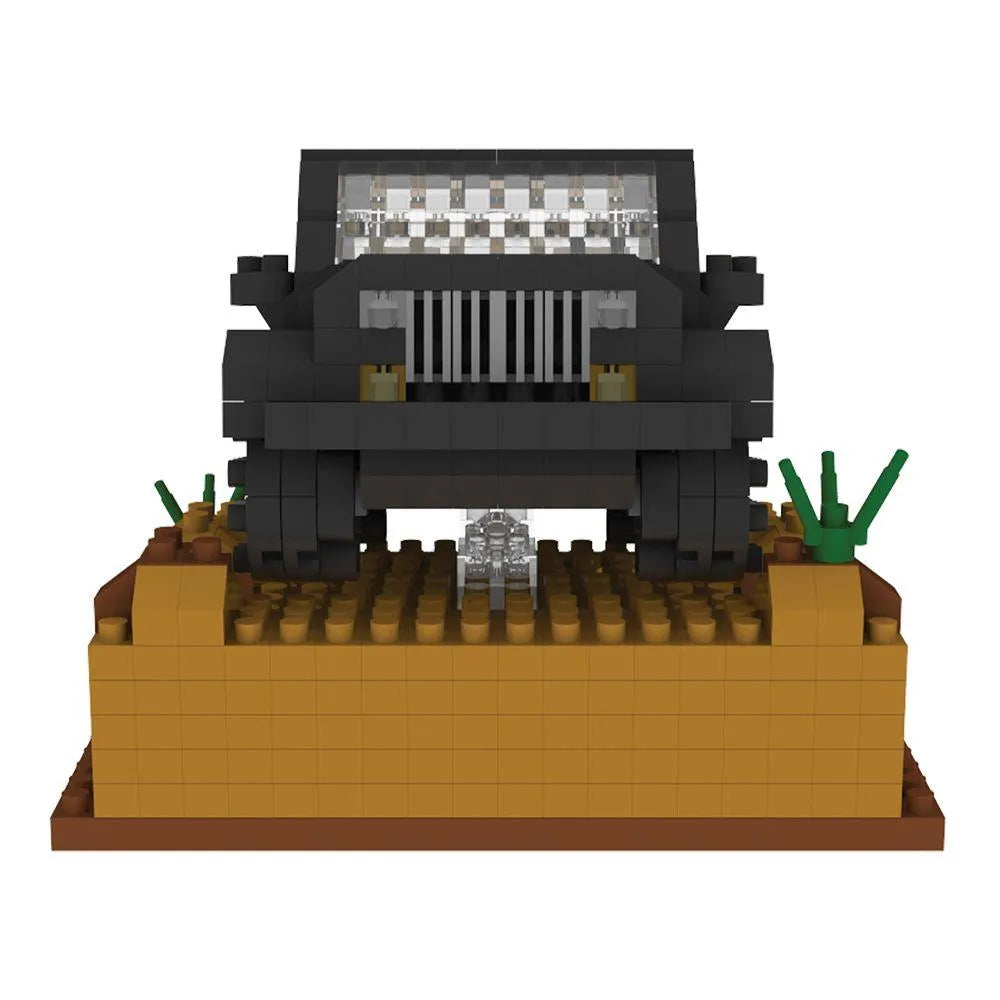 Box of mini building blocks off-road vehicle set with desert landscape design.