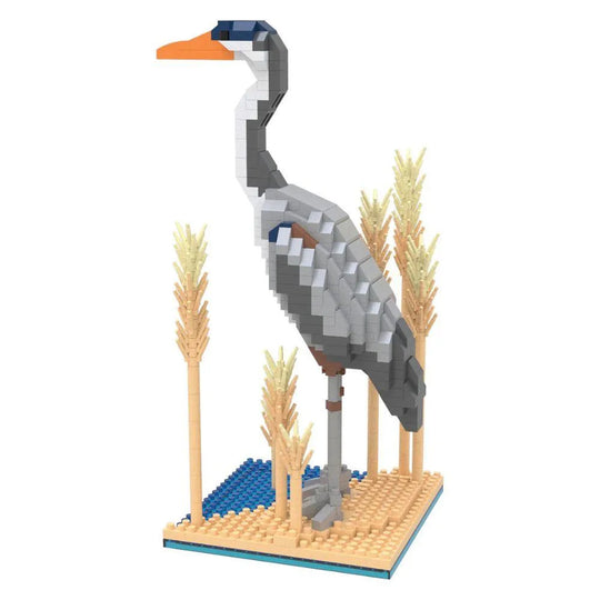 Mini building blocks set with a Great Blue Heron on a blue and tan baseplate surrounded by blocks made to look like reeds against a white background.