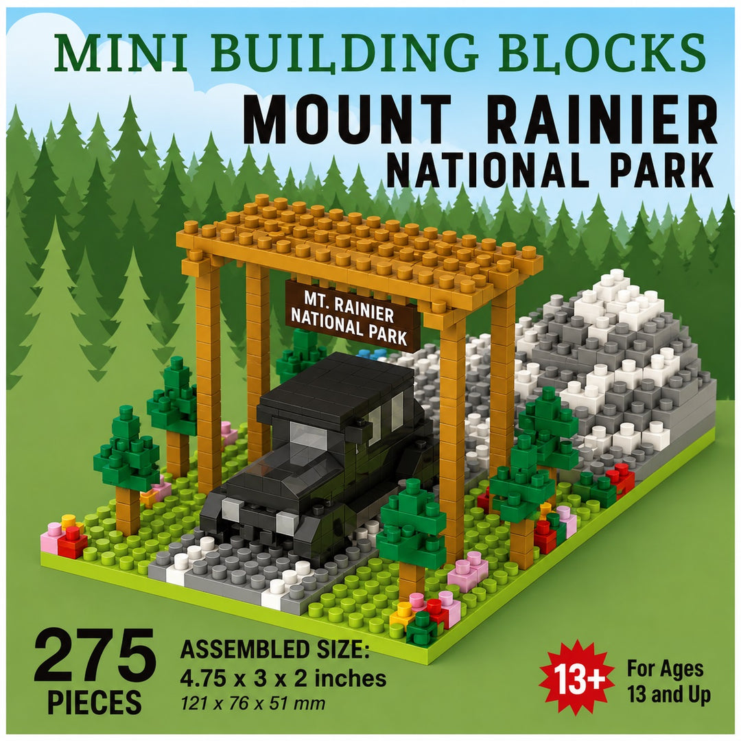 Buildable toy set packaging for a Mini Building Blocks set themed around Mount Rainier National Park. The image shows a assembled brick-built model of a forest scene with a black vintage car under a wooden sign, a gray mountain, and green trees on a grassy base.