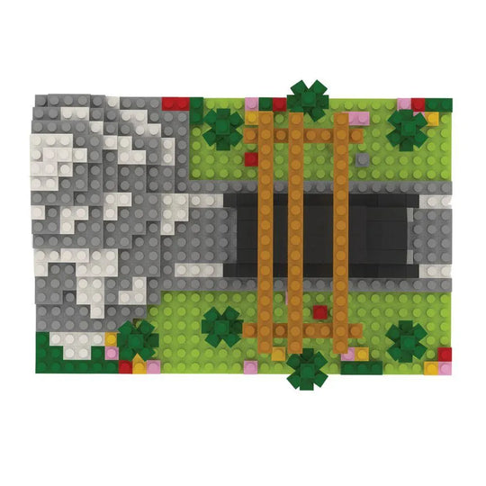 Mini block set of a truck under a wooden arch with 'Mt. Rainier National Park' sign, surrounded by trees and rocks on a white background.