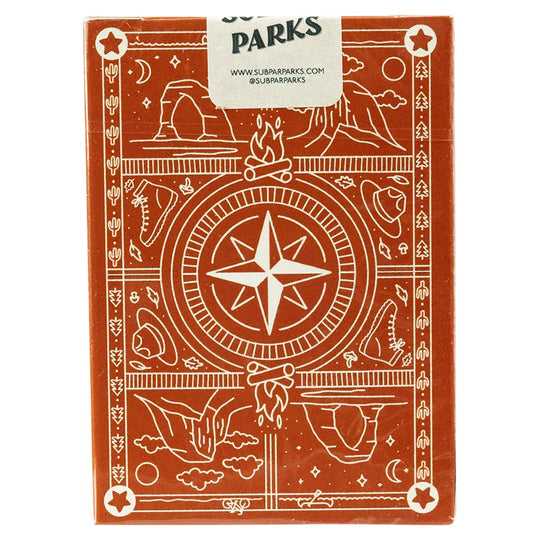 Pack of playing cards with a compass design and &
