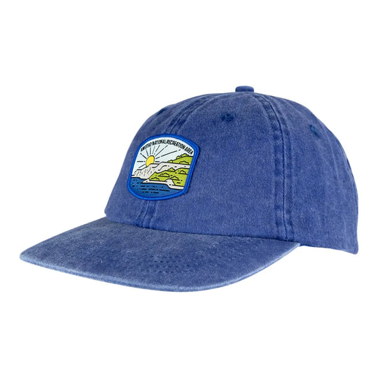 Blue denim cap with a patch on a white background