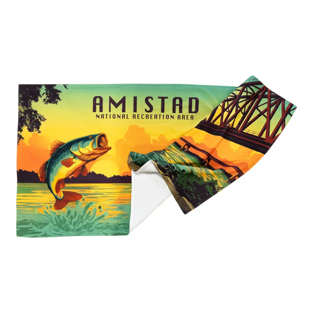 Fishing-themed towel with 'Amistad National Recreation Area' design featuring a fish and bridge.