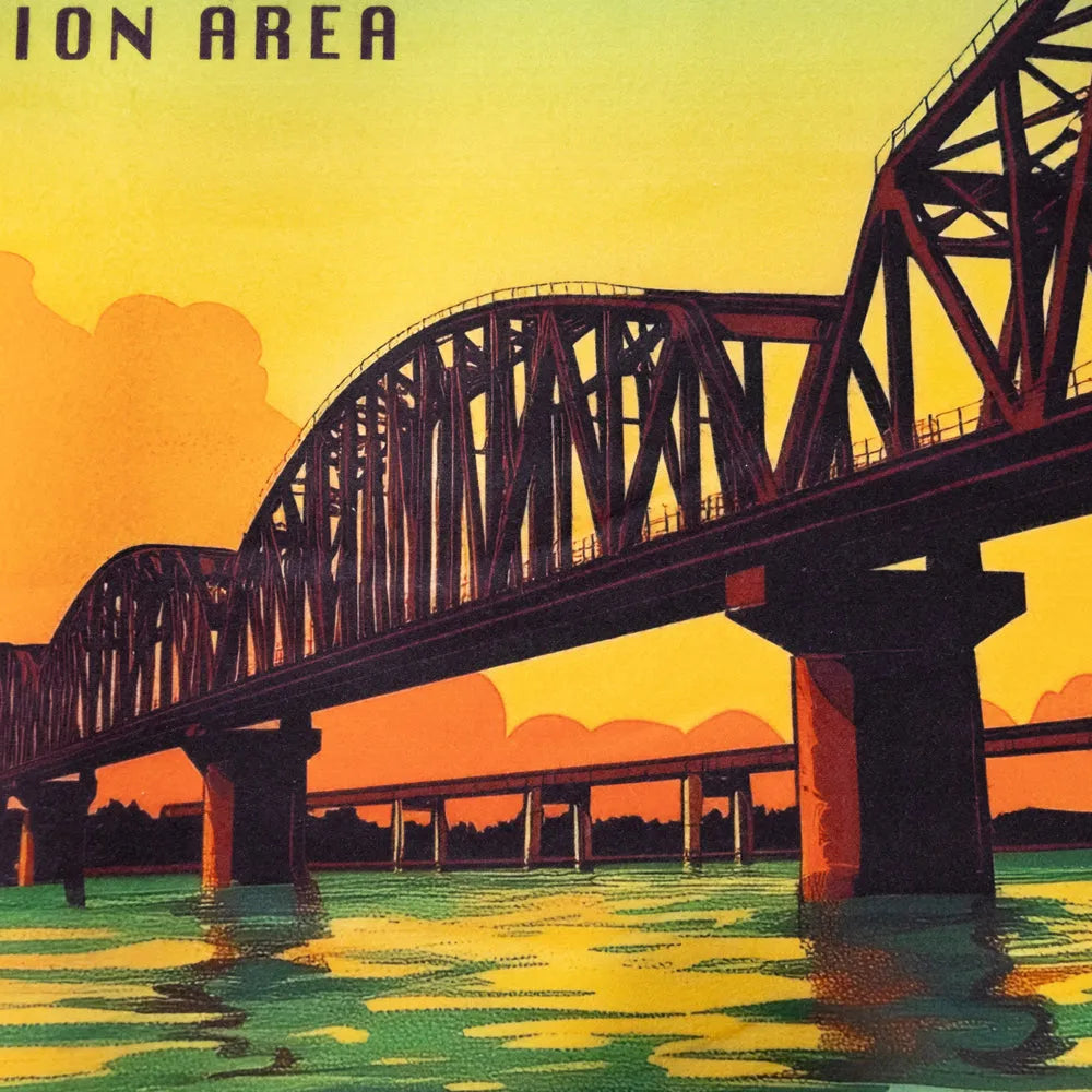 Bridge over water with a sunset or sunrise in the background