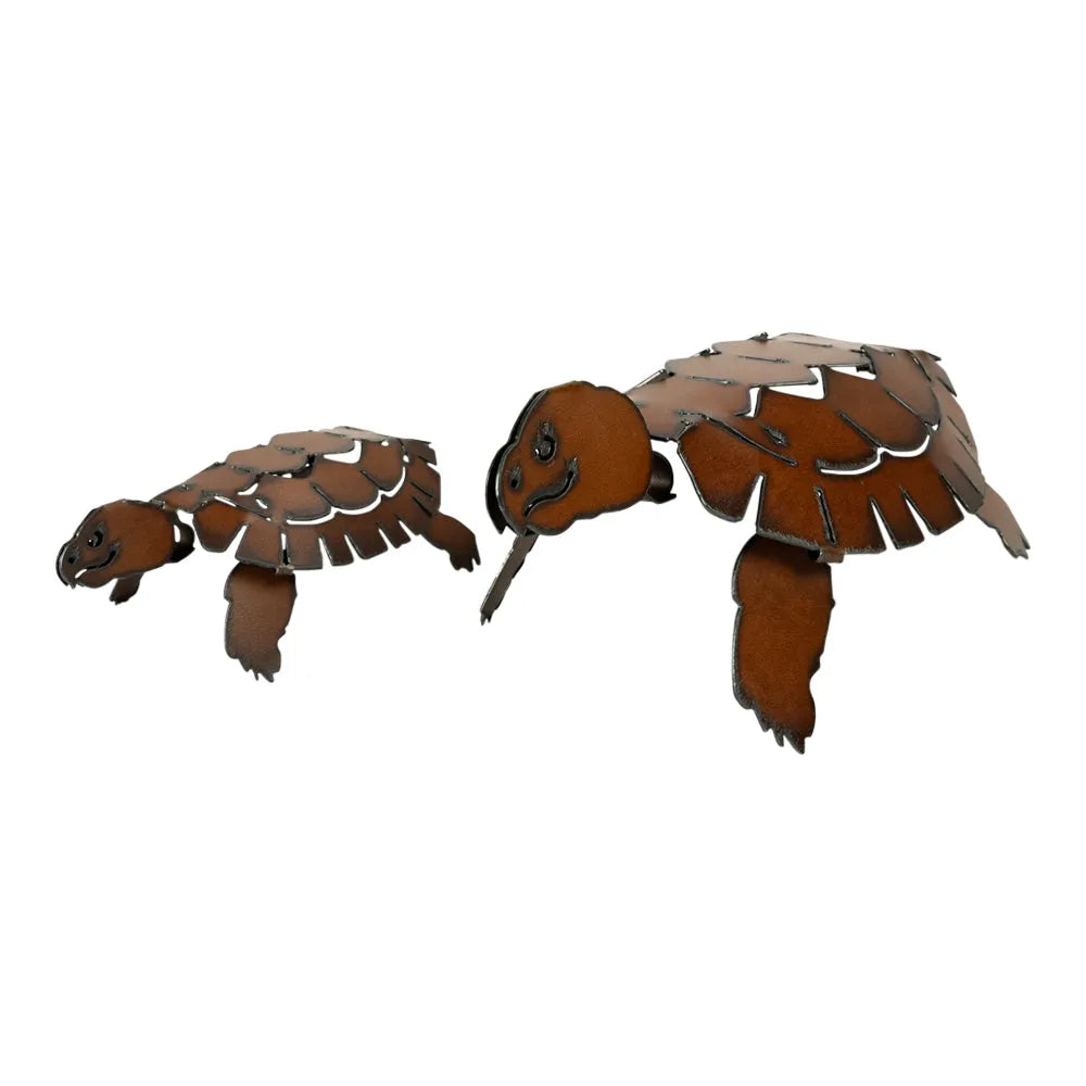Two metal turtles with brown patina on a white background
