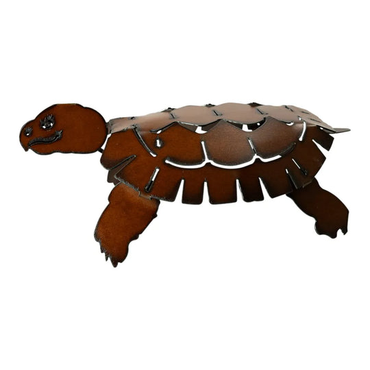 Decorative metal turtle-shaped yard art on a white background