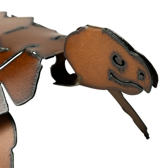 Brown metal turtle head with open mouth on a white background