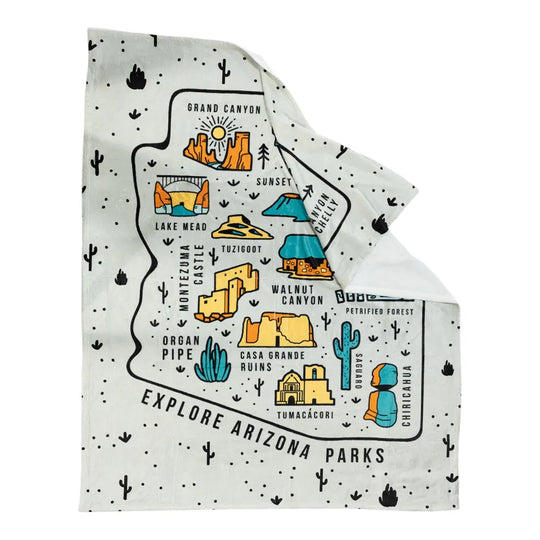 Folded fleece blanket with a map of Arizona parks design on a white background