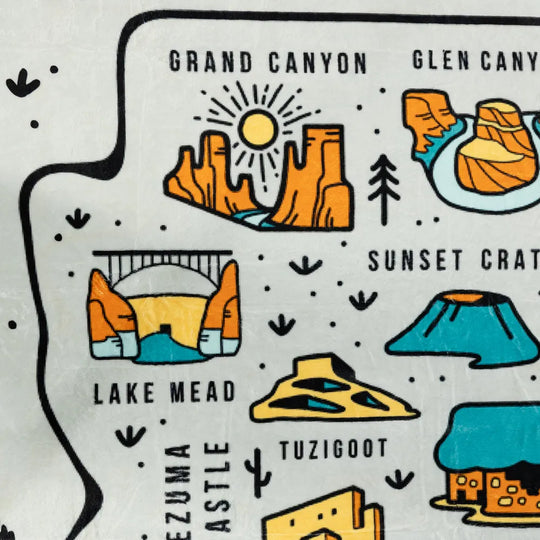 Detail of fleece blanket depicting Grand Canyon, Lake Mead, Sunset Crater, and more
