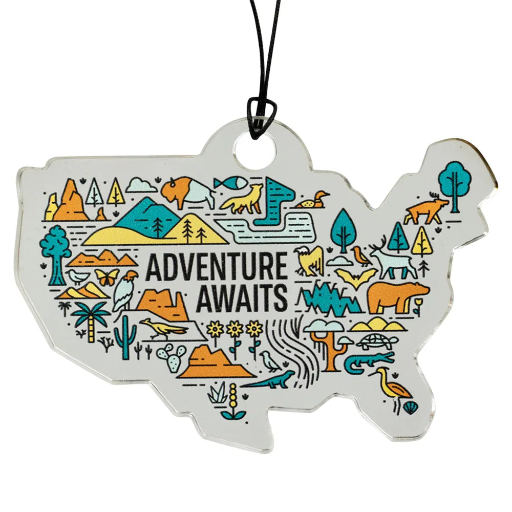 USA map-shaped ornament with nature-themed illustrations and 'Adventure Awaits' text on a white background.