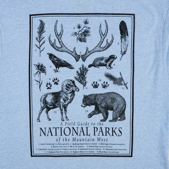 T-shirt with a graphic of animals and nature elements on a light blue background
