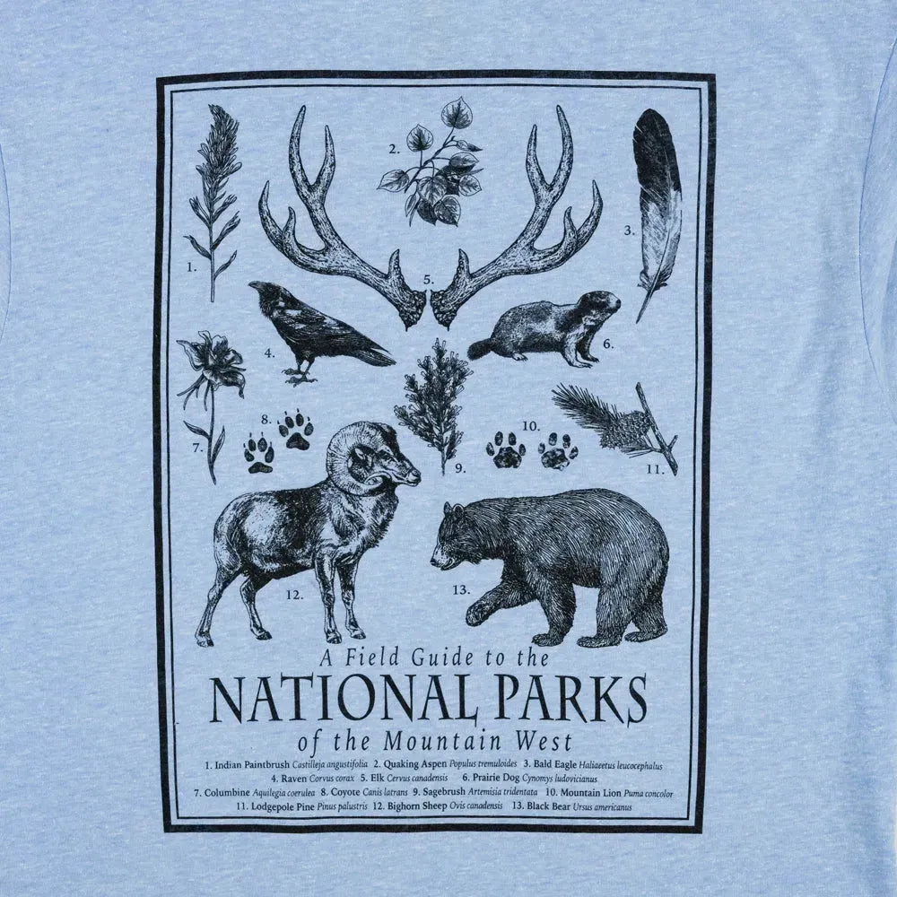 T-shirt with a graphic of animals and nature elements on a light blue background