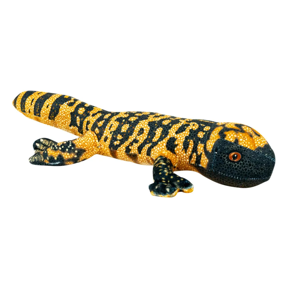 A realistic toy or figurine of a yellow and black striped gila monster with a textured, dotted surface and a small orange eye, isolated on a white background.