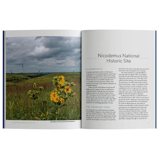 Open book showing a photograph of a field with yellow flowers and text about Nicodemus National Historic Site.