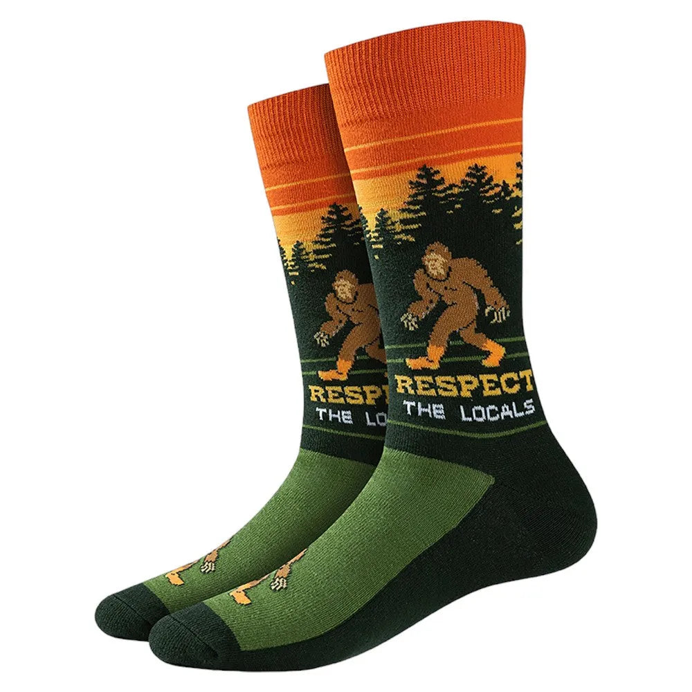Pair of socks with a Bigfoot design and 'Respect the Locals' text on a white background.