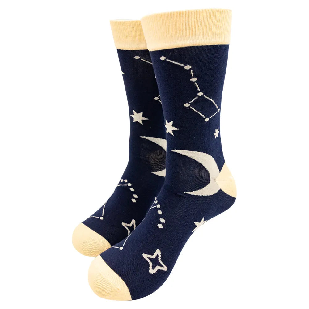 Navy blue socks with celestial designs on a white background
