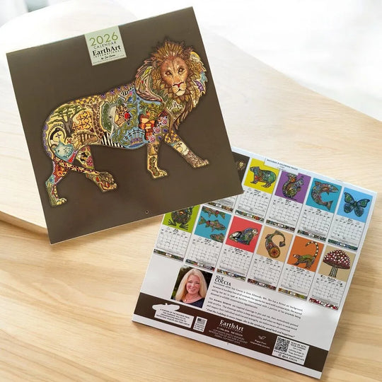 Colorful lion-themed calendar on a wooden surface
