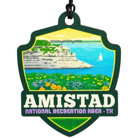 Amistad National Recreation Area badge shaped ornament with scenic illustration and text