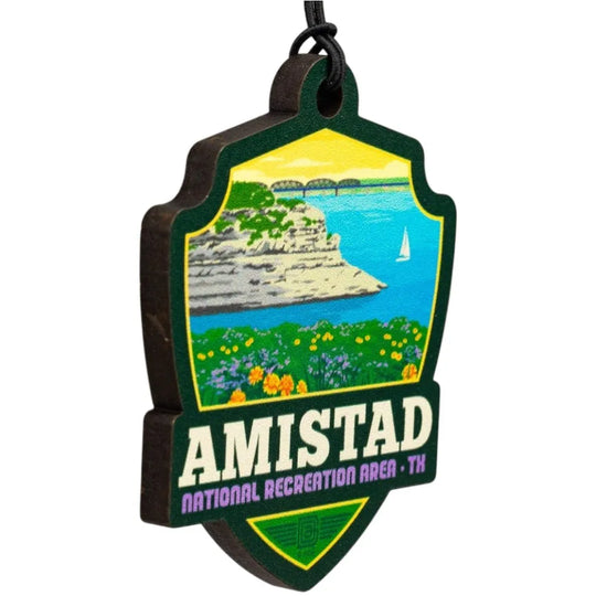 Amistad National Recreation Area badge shaped ornament with scenic illustration and text
