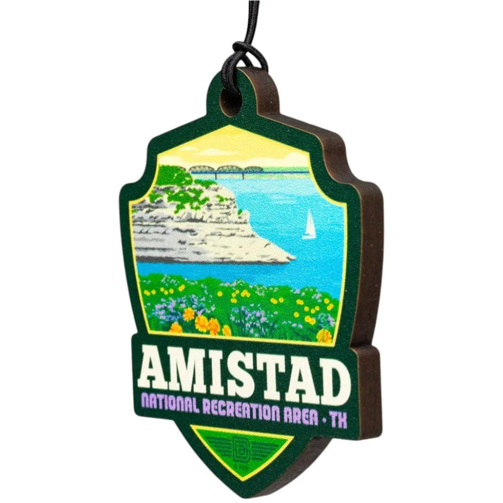 Amistad National Recreation Area badge shaped ornament with scenic illustration and text