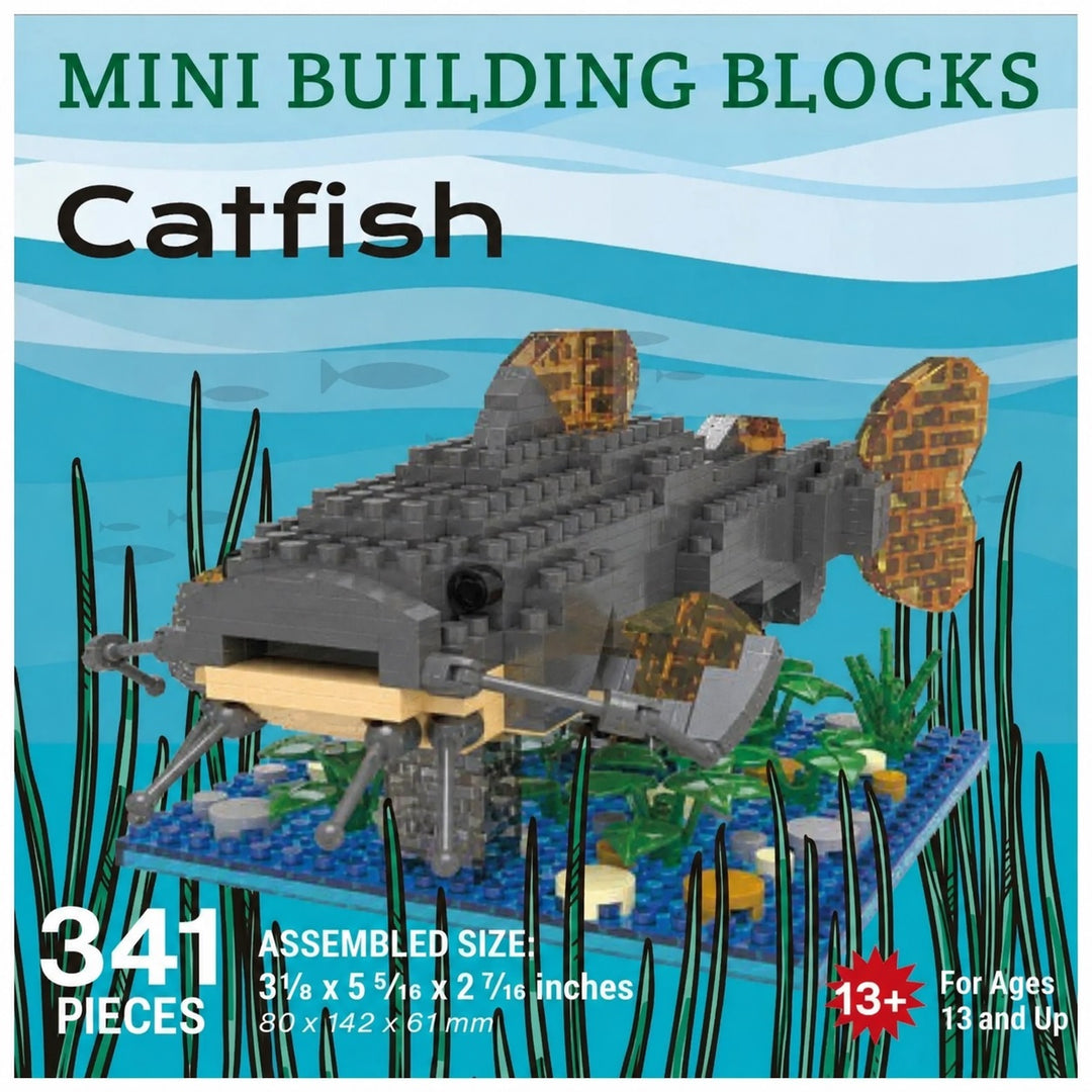 Box-style product graphic for a mini building blocks catfish set. The central image shows a gray and black assembled catfish model with translucent gold-orange fins and a blue base, surrounded by illustrated seaweed on a blue underwater background.