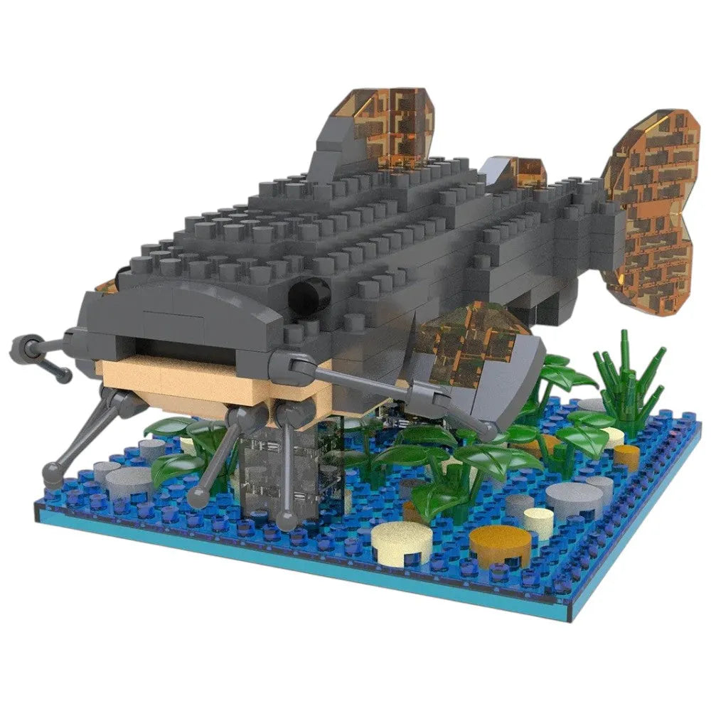 Toy catfish model made of interlocking bricks on a baseplate with aquatic decorations.