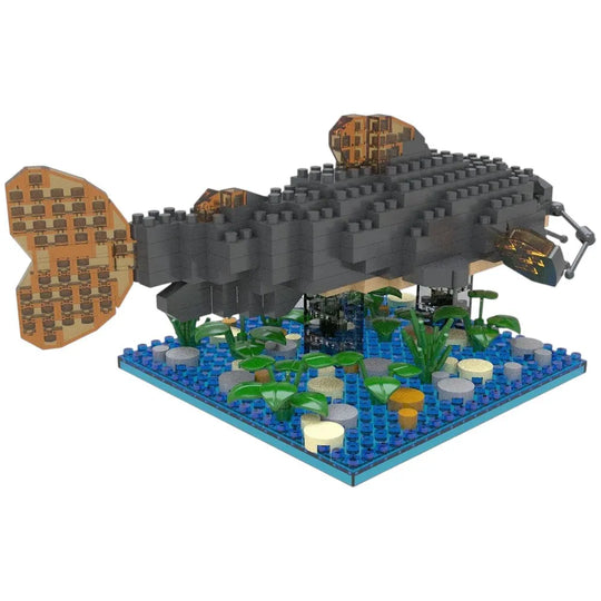 Toy model of a large fish with a detailed base on a white background