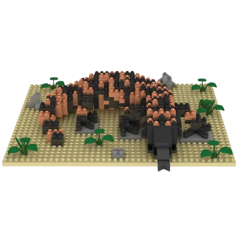 Toy gila monster model made from interlocking bricks on a white background
