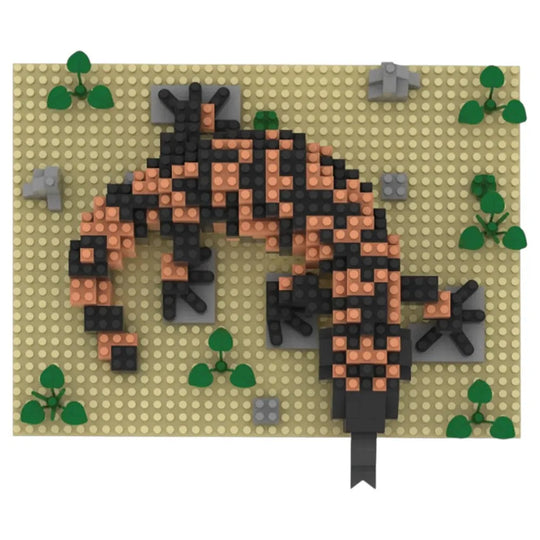 Gila monster made of interlocking bricks on a beige baseplate with green leaves.