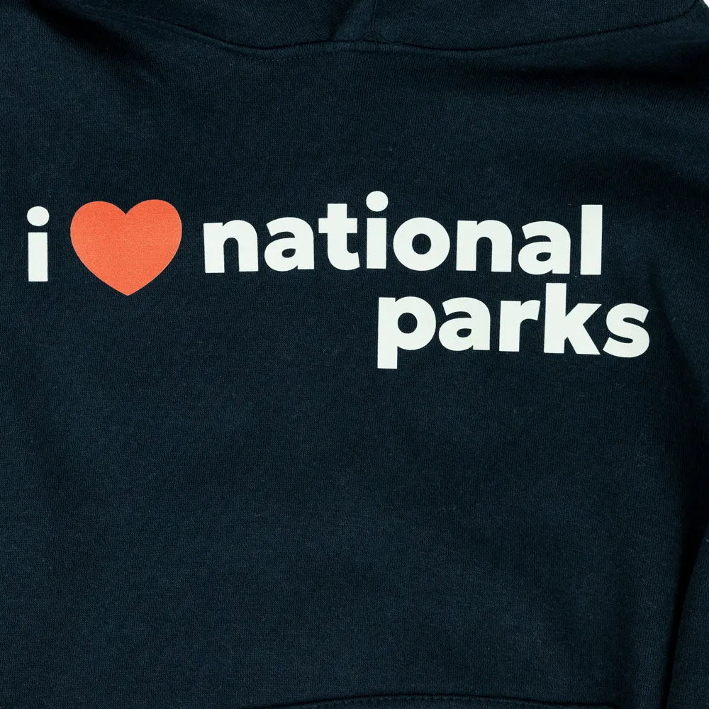 Close-up of a dark navy hoodie featuring the text &