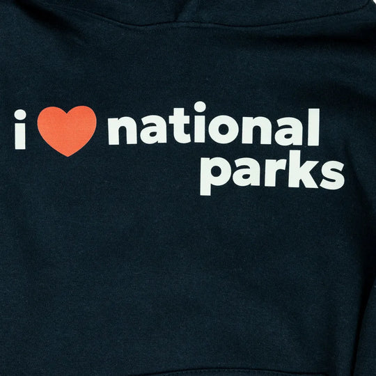 Close-up of a dark navy hoodie featuring the text &