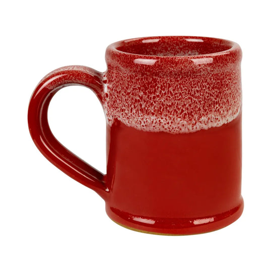 A red ceramic mug with a glossy finish, featuring a textured, speckled glaze around the upper half and a solid red lower body, set against a plain white background.