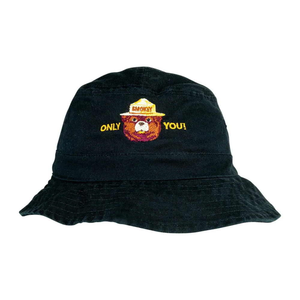 A black bucket hat featuring an embroidered design of a bear wearing a yellow ranger hat with the text &