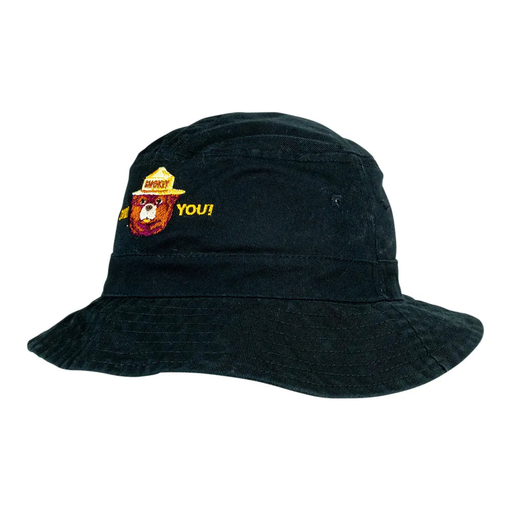 A black bucket hat with a yellow embroidered logo on the front. The hat is photographed against a plain white background.