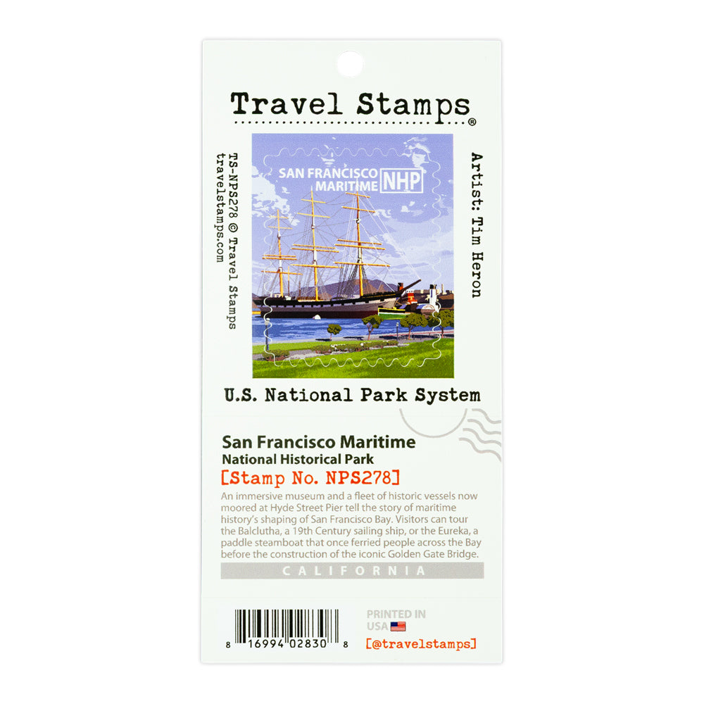 A Travel Stamps collectible travel stamp card for San Francisco Maritime National Historical Park, featuring a colorful illustration of historic ships and a lighthouse on the card, with detailed text and a barcode.