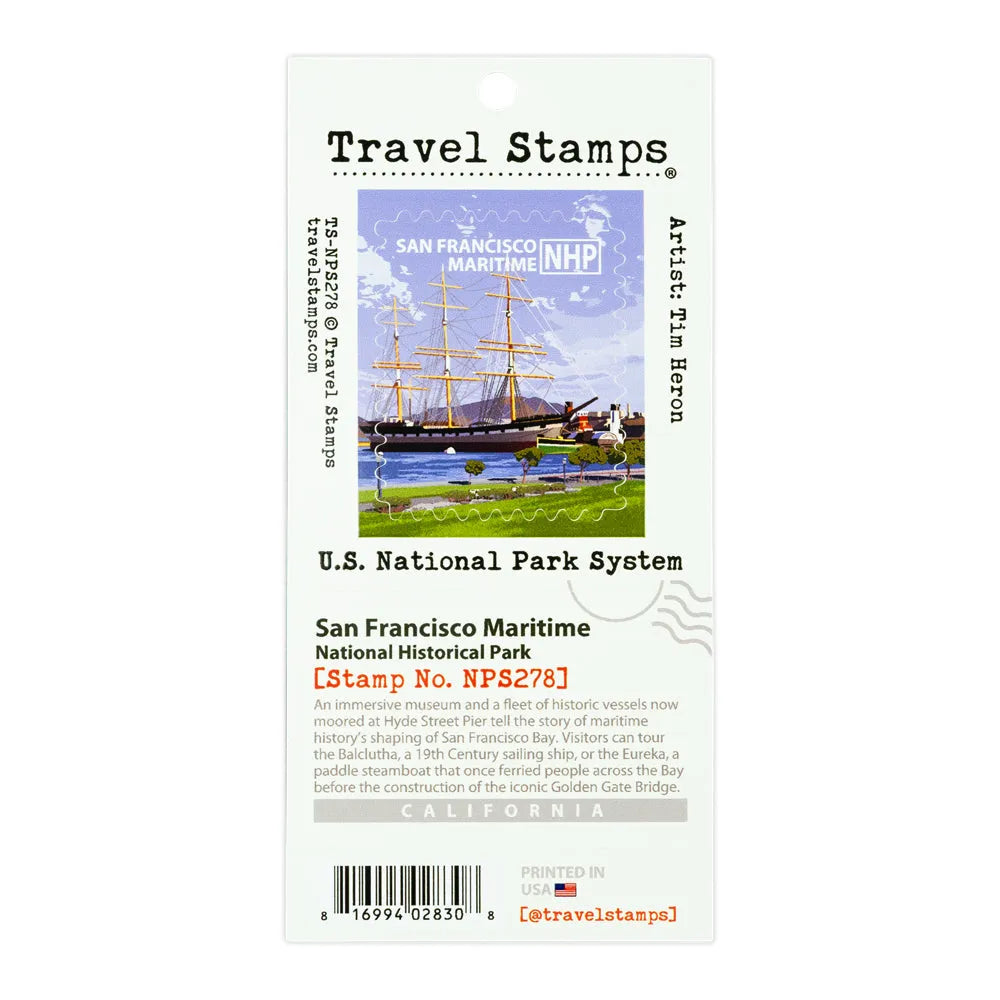 A Travel Stamps collectible travel stamp card for San Francisco Maritime National Historical Park, featuring a colorful illustration of historic ships and a lighthouse on the card, with detailed text and a barcode.