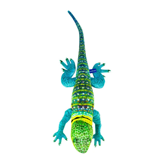 A colorful lizard plush toy shown from above on a plain white background. The body is primarily green and blue with bright turquoise legs and hands, a yellow band around the neck, and multicolored scale details along the back.