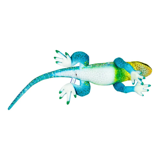 A colorful gecko figurine or toy shown in profile on a plain white background. The gecko has a blue tail and legs, a white belly, green and yellow accents on its back and head, and bright blue toes.